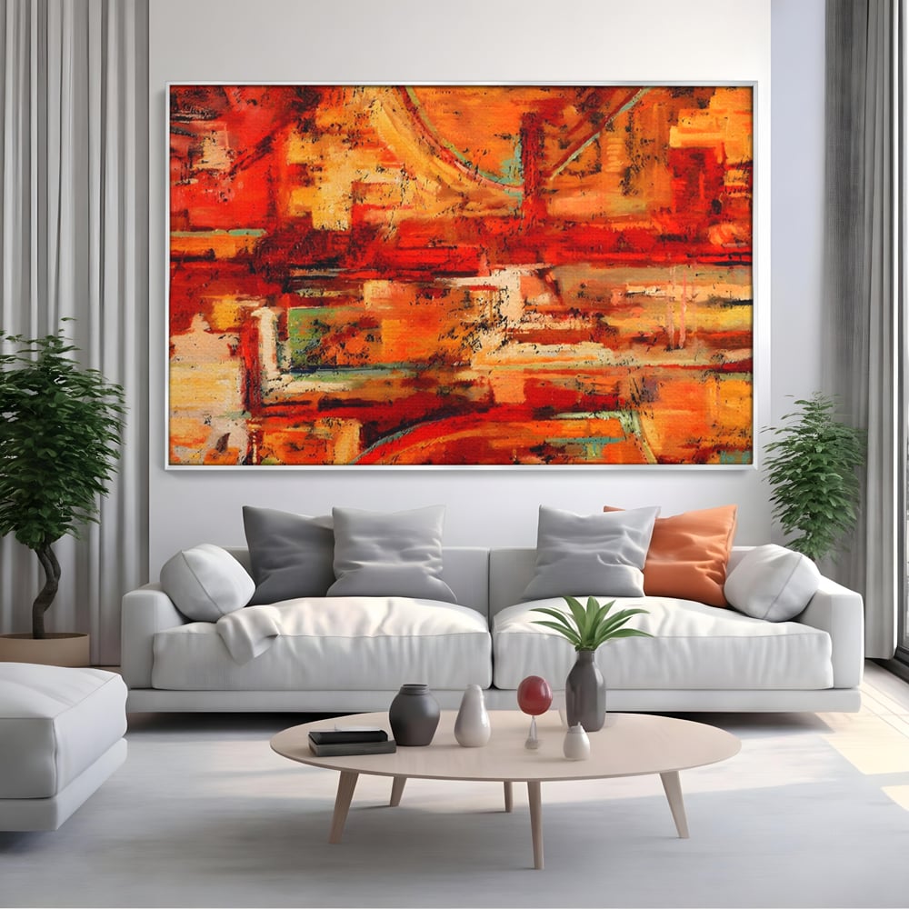 Tablou canvas cu pictura abstracta cu texturi in tonuri de rosu, in rama de aluminiu argintiu, pe perete intr-un living